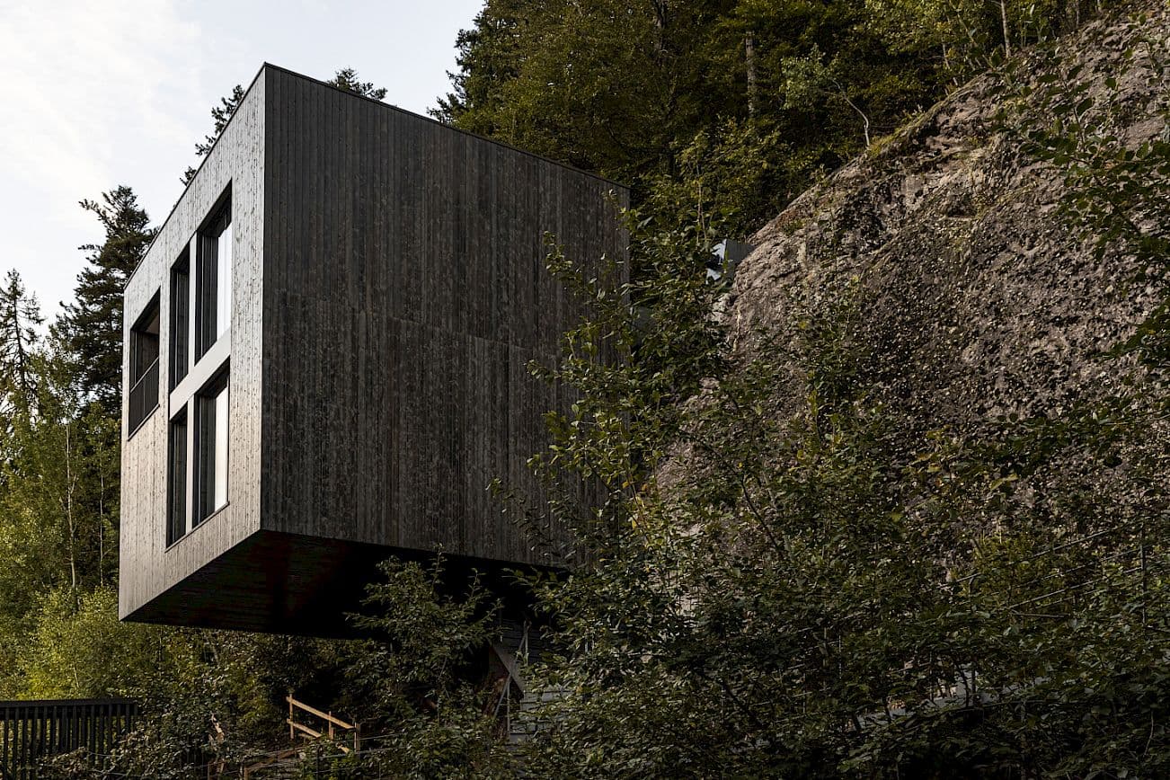 Hotel disappearing into the Dolomite landscape at dusk, South Tyrol