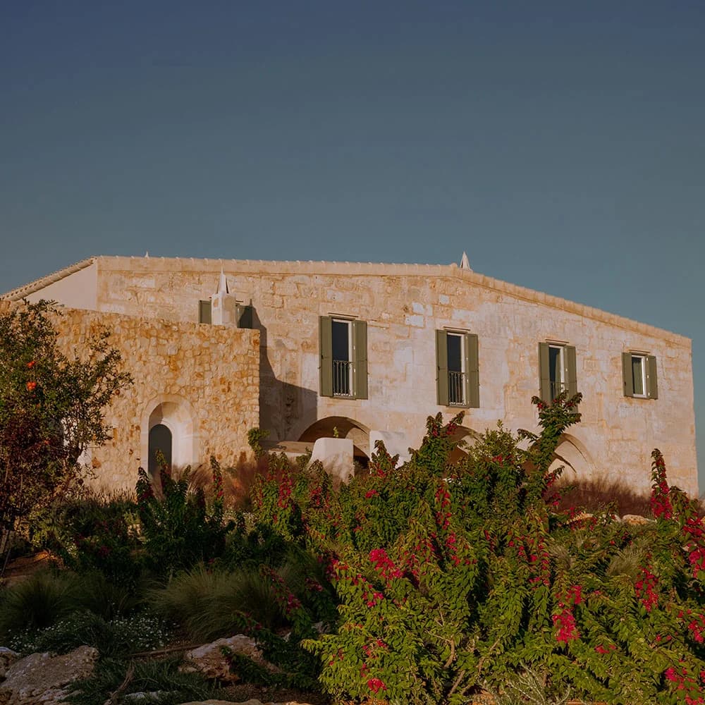 Son Blanc Farmhouse — restored stone exterior surrounded by Menorcan farmland