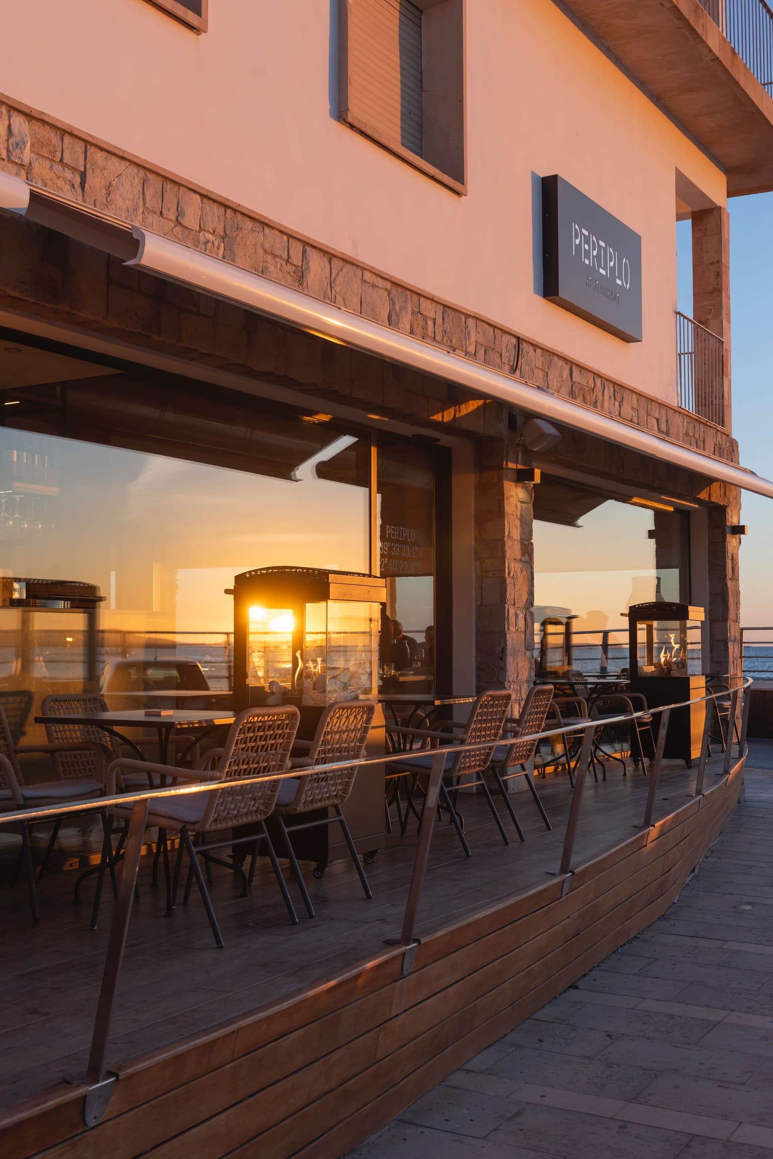 Periplo Portixol — Restaurant terrace at golden hour, Portixol seafront