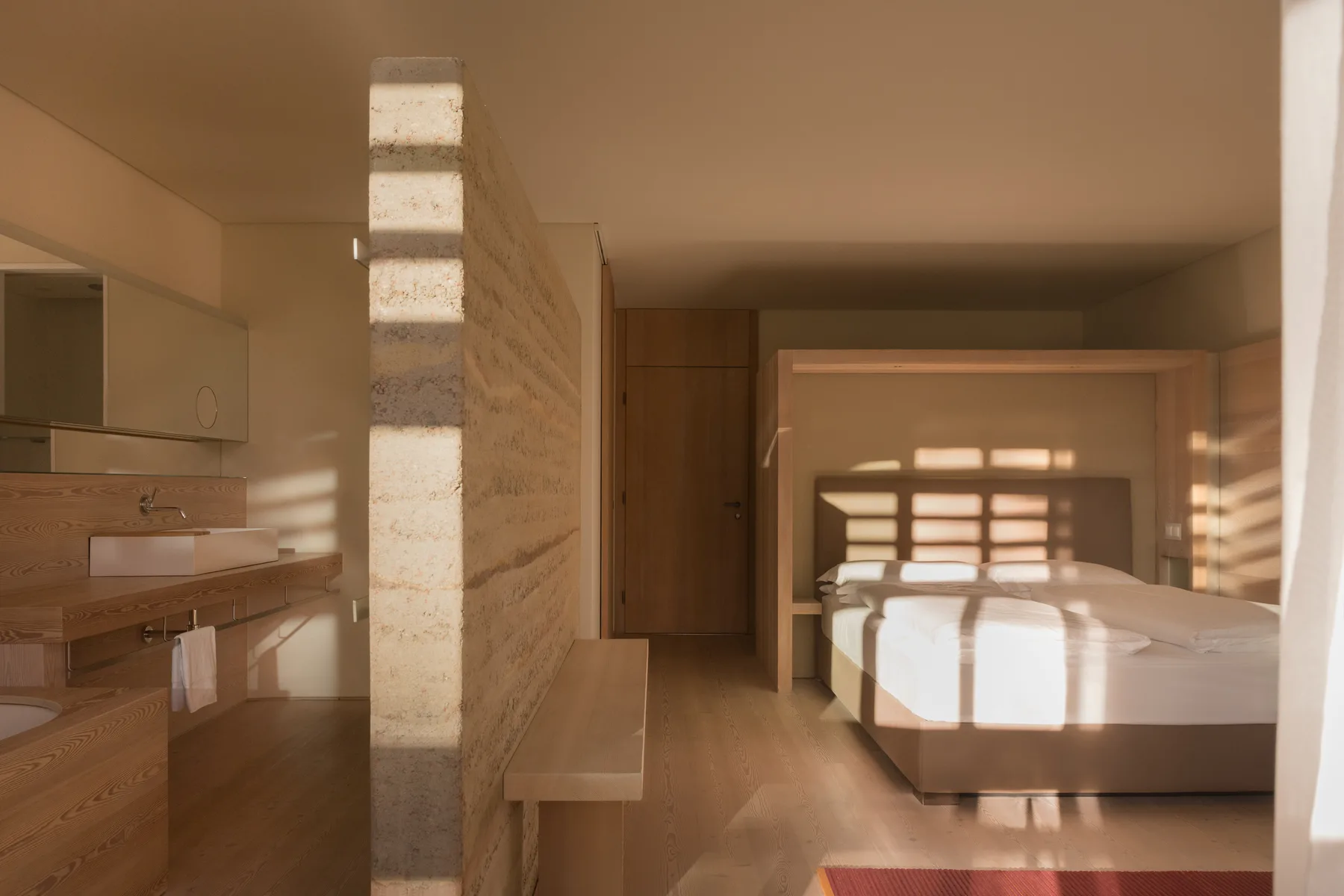 Room oriented to the sun with natural materials at vigilius mountain resort.