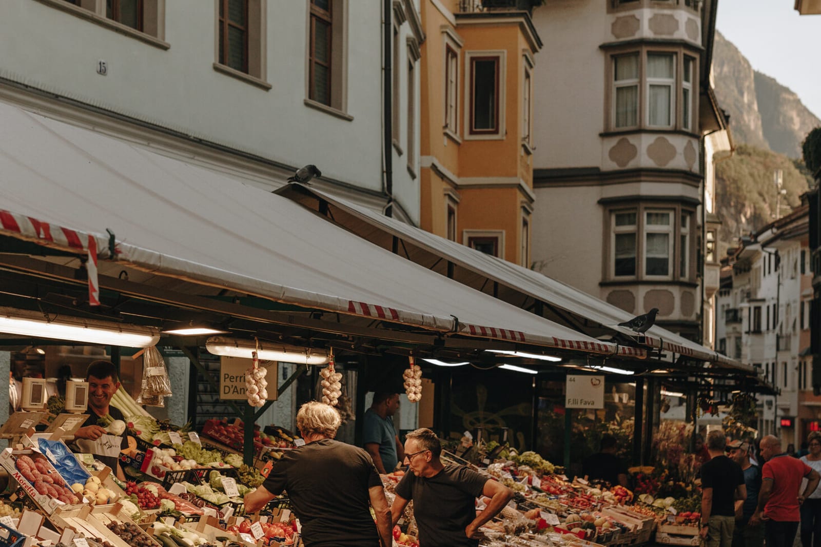 The lively old-town streets and market of Bolzano beneath the Dolomites