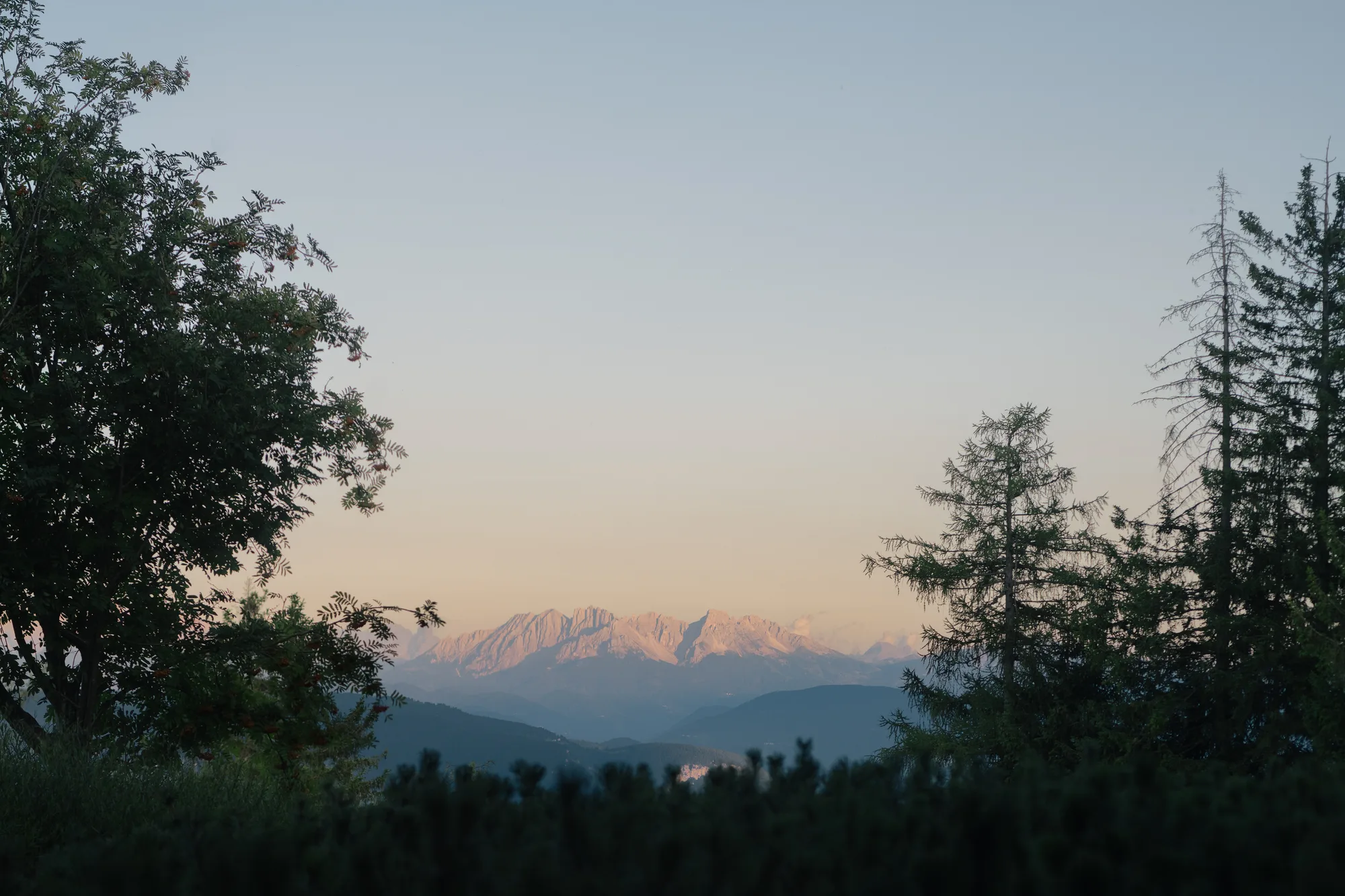 View towards the snow-capped Dolomites at dusk from vigilius mountain resort.